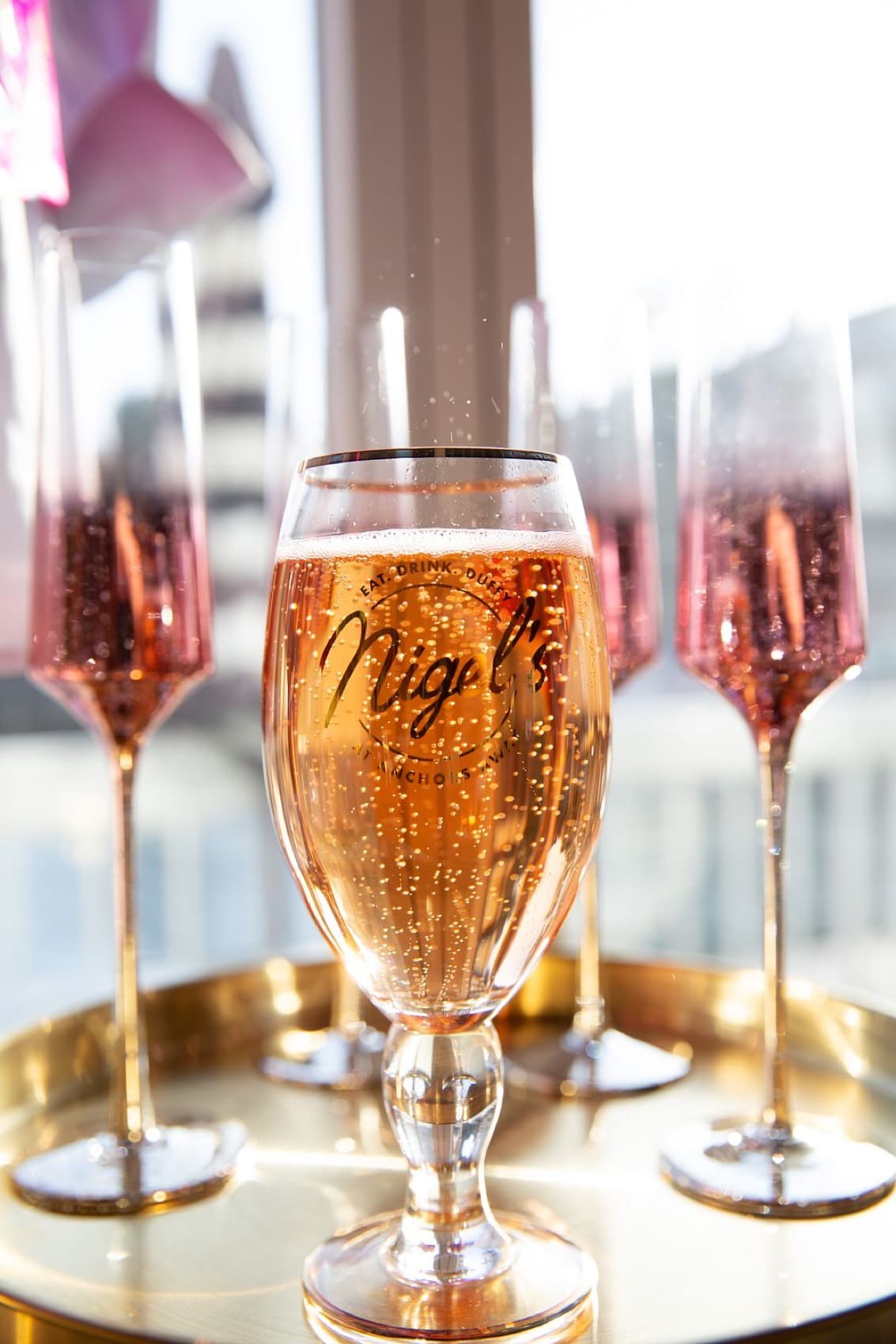 A branded Nigel's flute of sparkling rosé