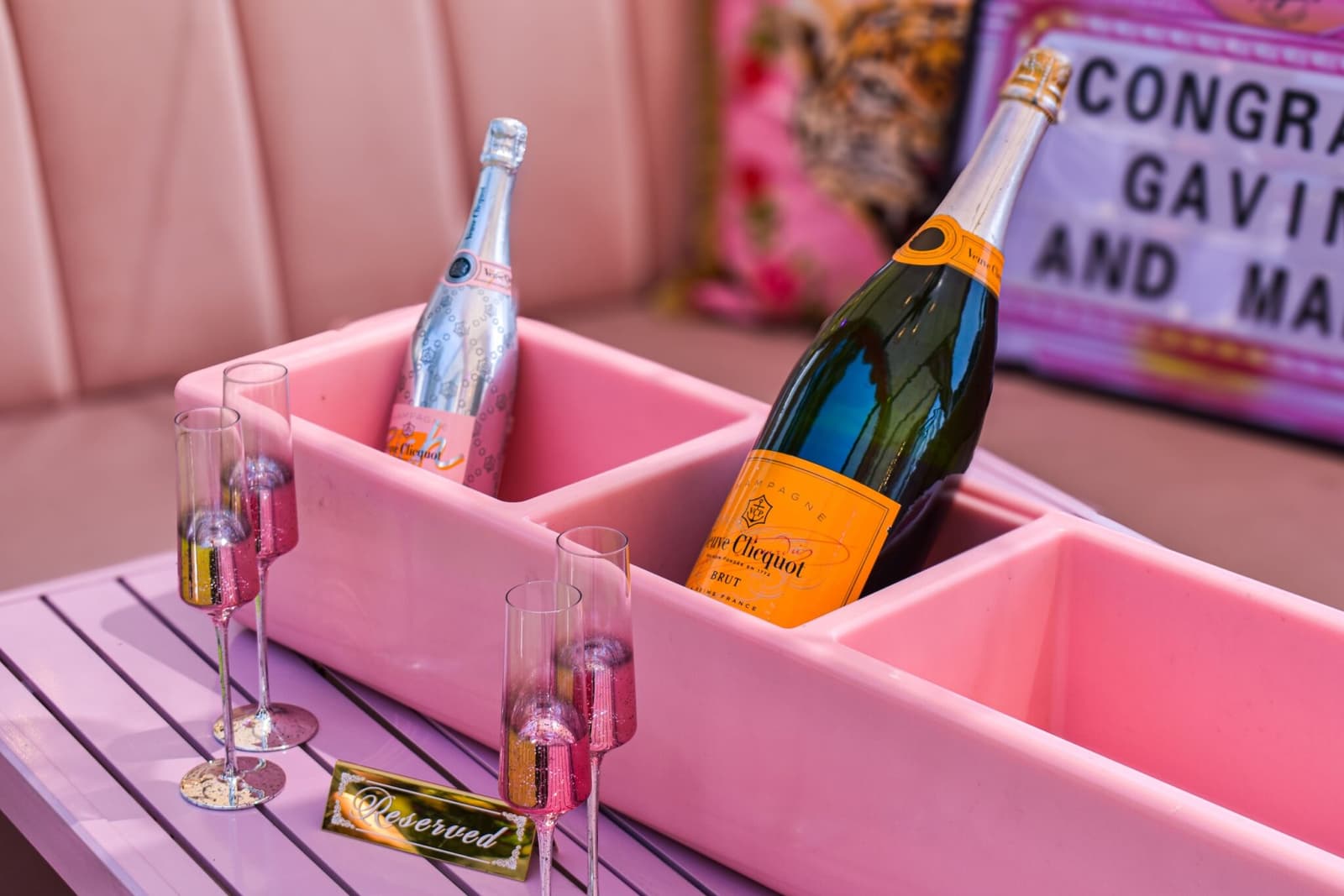 Veuve Clicquot chilling in a pink caddy with rose flutes